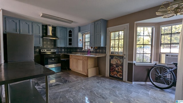 kitchen with cooling unit, sink, tasteful backsplash, wall chimney range hood, and appliances with stainless steel finishes