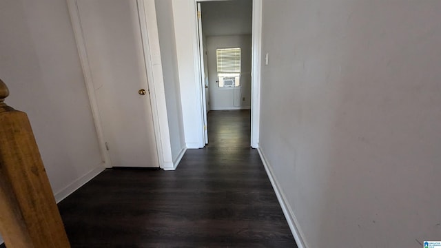 corridor with dark hardwood / wood-style floors