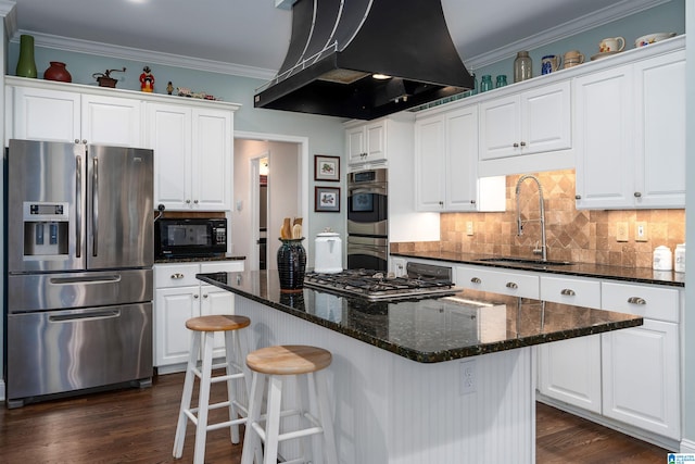 kitchen with sink, appliances with stainless steel finishes, white cabinets, island exhaust hood, and dark wood-type flooring