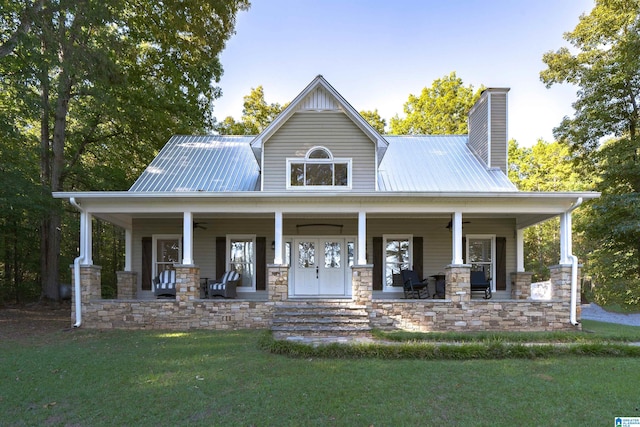 view of front facade with covered porch and a front lawn