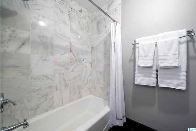 bathroom featuring shower / bathtub combination with curtain