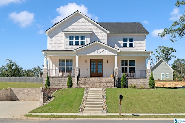 craftsman-style house with a front yard and covered porch