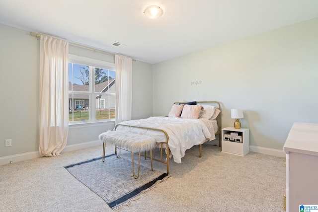 bedroom with light colored carpet