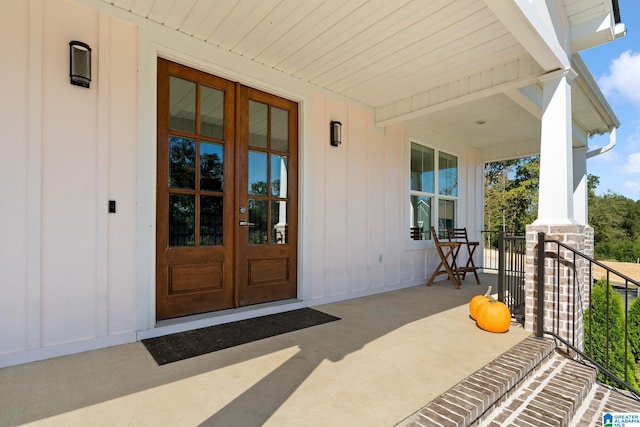 doorway to property featuring french doors and a porch