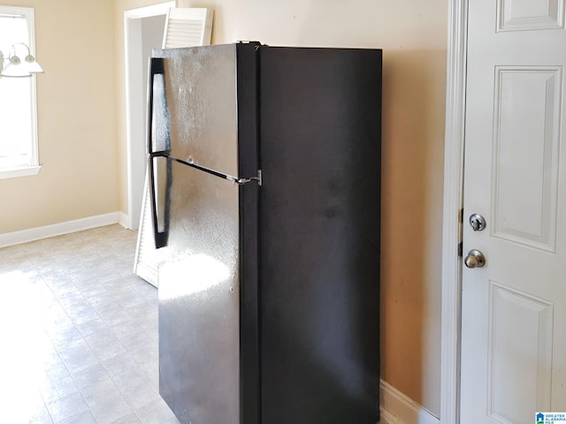 kitchen with black refrigerator