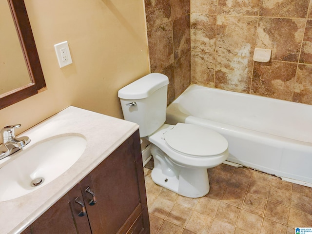 bathroom featuring tile patterned floors, vanity, and toilet