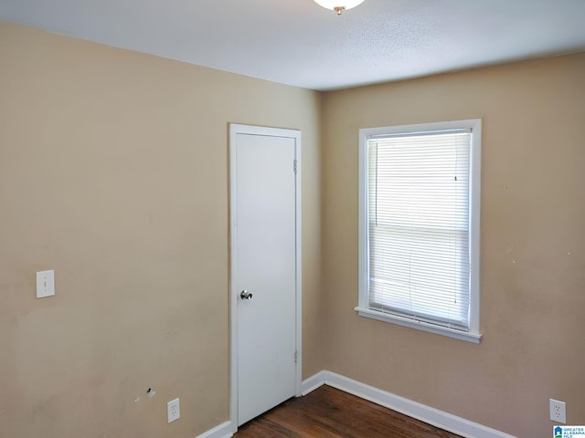 empty room featuring dark hardwood / wood-style floors