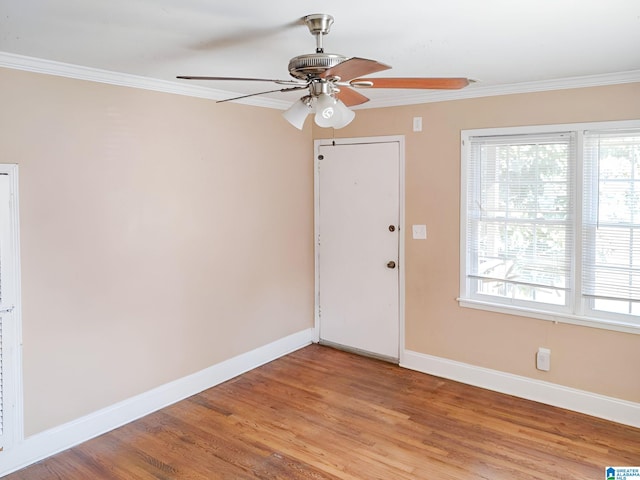 spare room featuring ceiling fan, crown molding, and light hardwood / wood-style floors