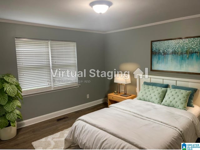 bedroom with crown molding and dark hardwood / wood-style flooring