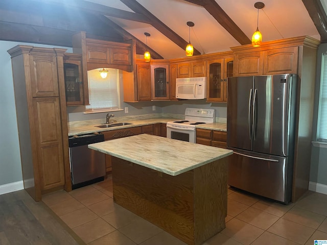 kitchen with stainless steel appliances, hanging light fixtures, lofted ceiling with beams, and sink