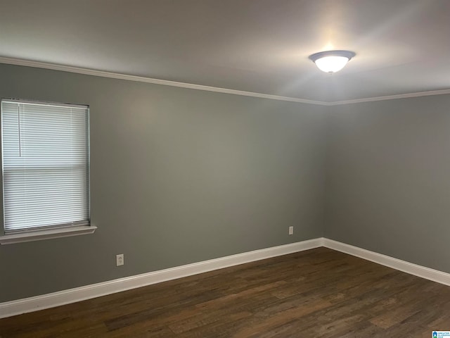 unfurnished room with dark wood-type flooring and crown molding