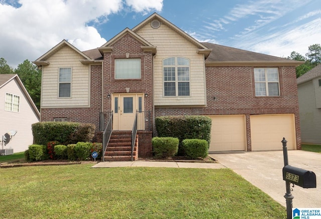 view of front of property featuring a garage and a front yard