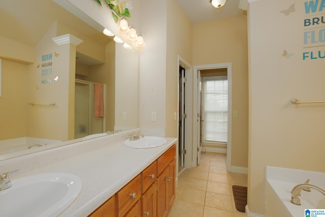 bathroom with tile patterned floors, separate shower and tub, and vanity