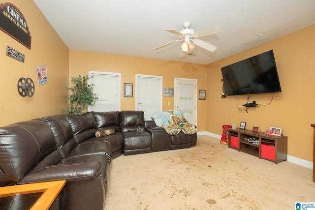 living room featuring carpet and ceiling fan