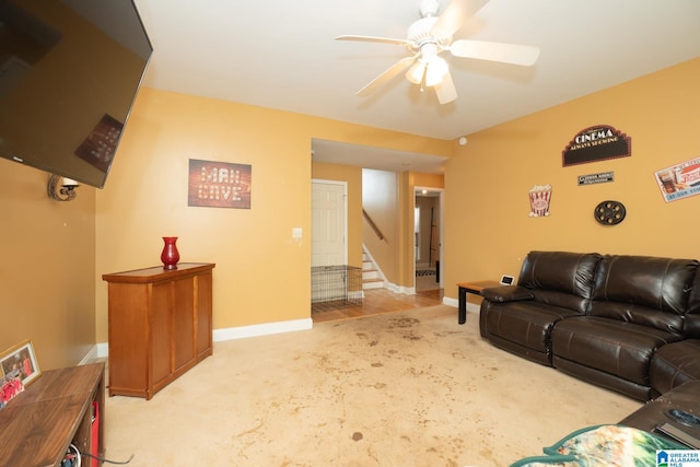 living room with light carpet and ceiling fan