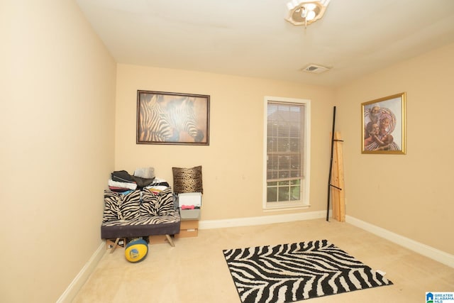 sitting room featuring carpet floors