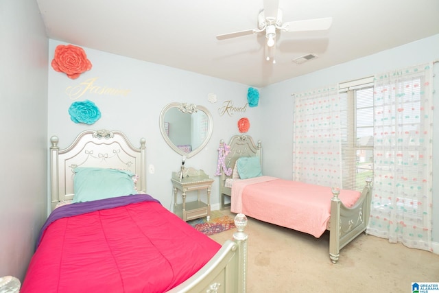 bedroom with ceiling fan and carpet