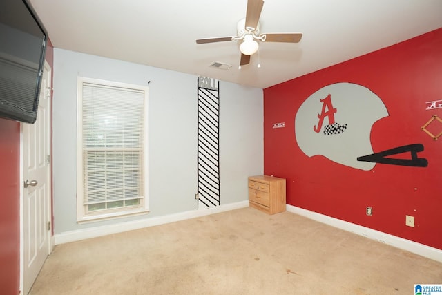 unfurnished bedroom featuring ceiling fan and light colored carpet