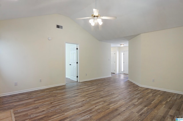 spare room with lofted ceiling, ceiling fan, and dark hardwood / wood-style flooring