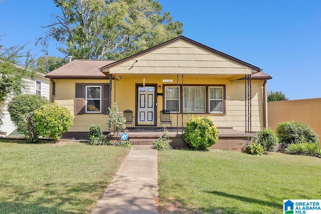 bungalow-style home featuring a front lawn