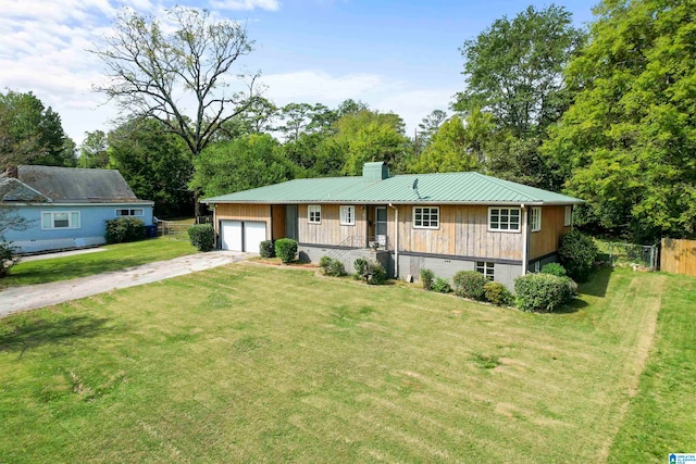 ranch-style house featuring a garage and a front lawn