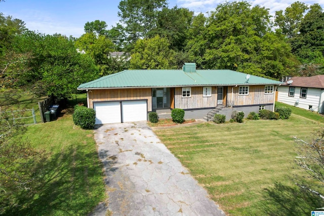 ranch-style home with a front yard, covered porch, and a garage