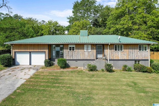 ranch-style house with a front lawn and a garage