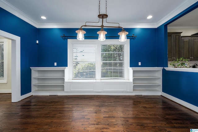 unfurnished dining area with dark hardwood / wood-style floors, a notable chandelier, and ornamental molding