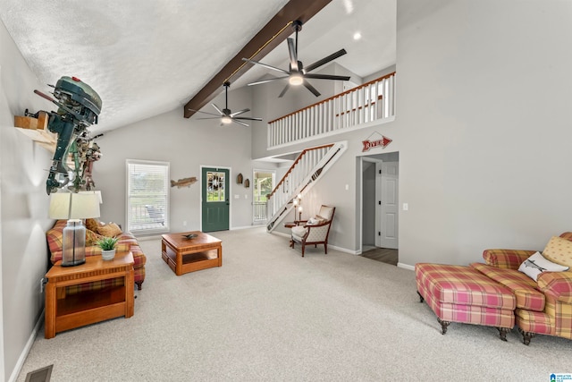 carpeted living room with ceiling fan, a textured ceiling, beam ceiling, and high vaulted ceiling