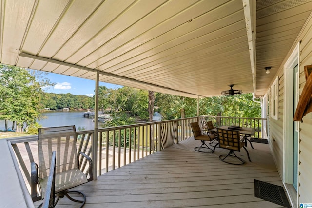 deck featuring a water view and ceiling fan