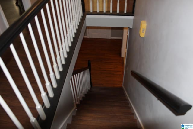 stairway featuring hardwood / wood-style floors