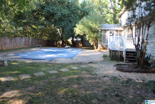 view of yard featuring a patio and a covered pool