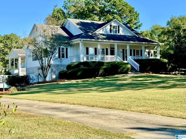 view of front of house with a porch and a front yard