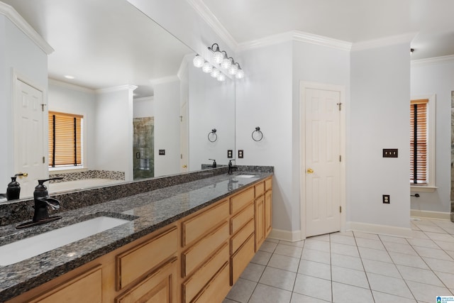 bathroom with vanity, crown molding, a shower with shower door, and tile patterned flooring