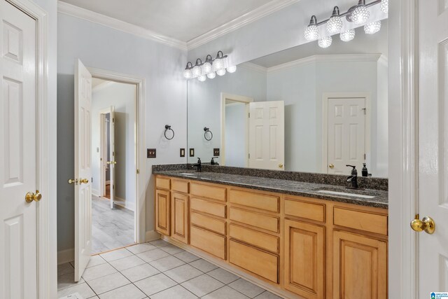 bathroom featuring vanity, ornamental molding, and tile patterned flooring