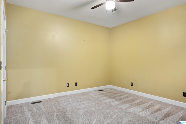 carpeted empty room featuring ceiling fan