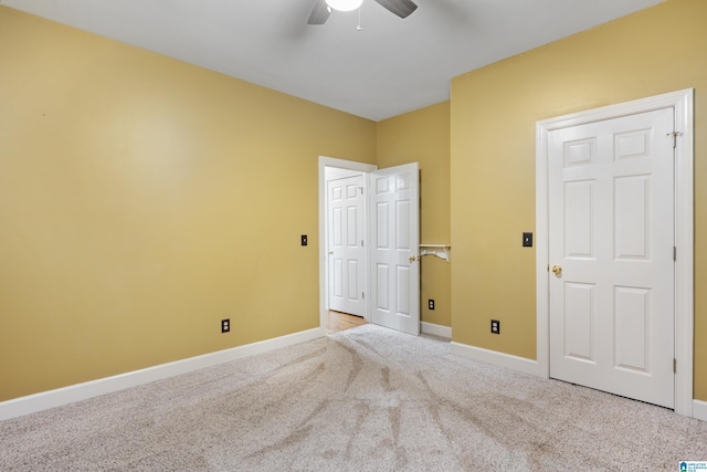 unfurnished bedroom with light carpet and ceiling fan