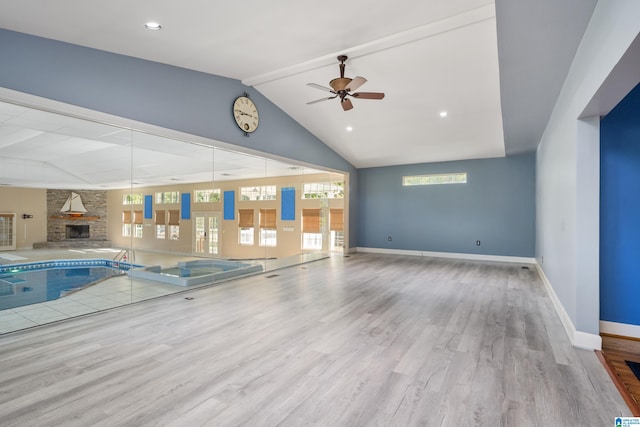 view of swimming pool featuring ceiling fan