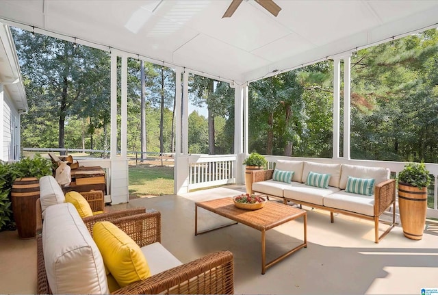 sunroom / solarium with a healthy amount of sunlight and ceiling fan