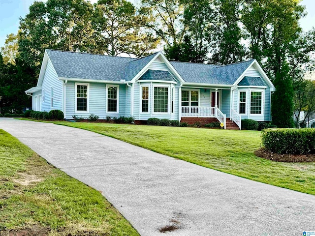 ranch-style home featuring a front yard and a porch