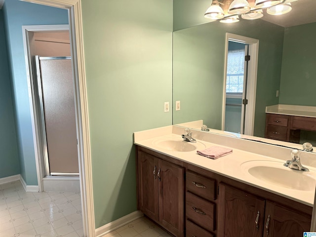 bathroom featuring walk in shower and vanity