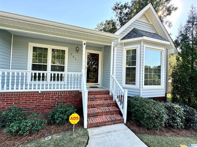 doorway to property featuring a porch