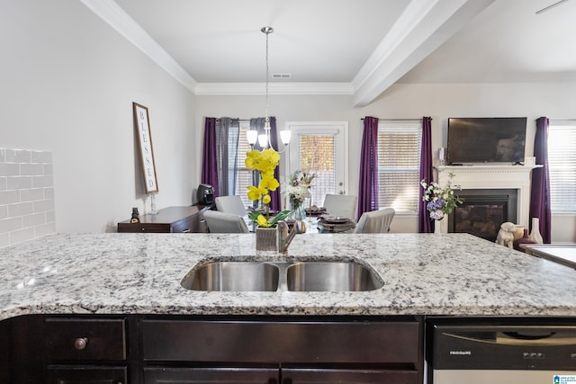 kitchen with dishwashing machine, tasteful backsplash, sink, and plenty of natural light