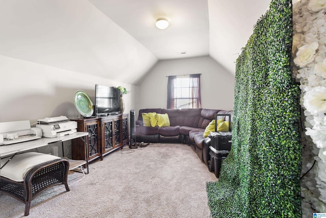 carpeted living room with vaulted ceiling