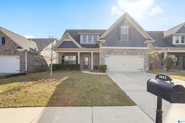 view of front of house with a front lawn and a garage