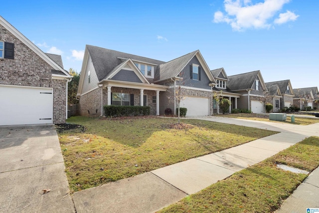 view of front of property with a front yard and a garage