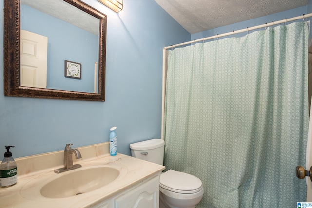 bathroom with a shower with shower curtain, vanity, toilet, and a textured ceiling