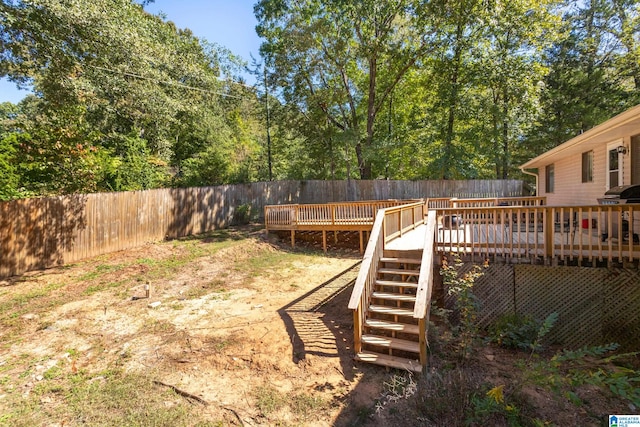 view of yard featuring a wooden deck