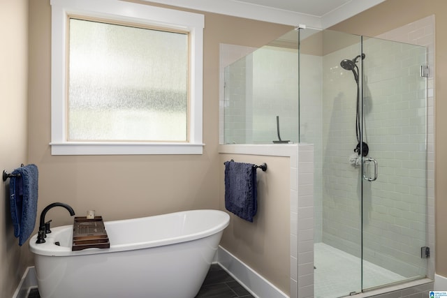 bathroom featuring separate shower and tub, crown molding, and tile patterned flooring