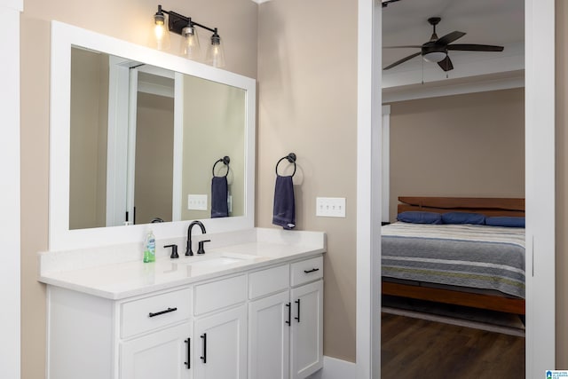 bathroom featuring hardwood / wood-style floors, ceiling fan, and vanity